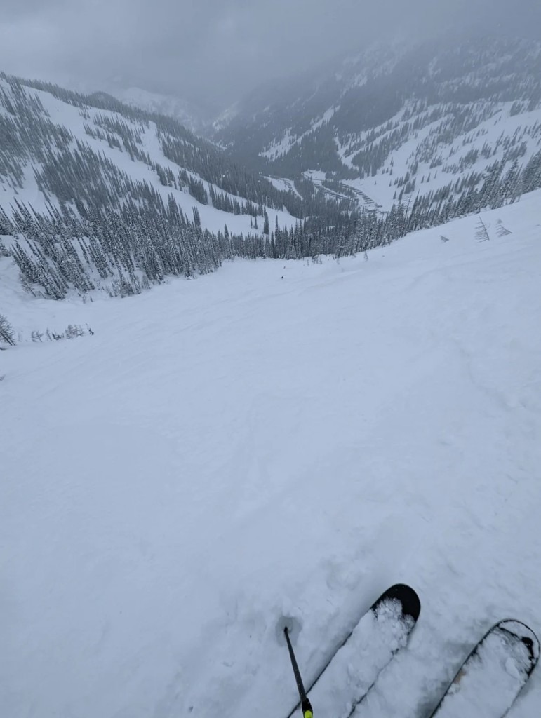 Before: snowy mountain in low visibility with overcast clouds